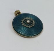 A Victorian circular locket attractively decorated