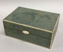 A rectangular shagreen and ivory box with hinged t