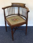 An Edwardian bow back corner chair with turned spi