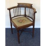 An Edwardian bow back corner chair with turned spi