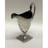 A Georgian silver bright cut cream jug with bead w