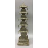 A massive carved ivory pagoda with tassel drops. A