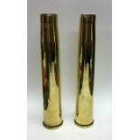 A pair of heavy tapering shell cases. Est. £20 - £