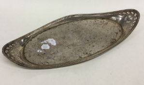 A Georgian silver oval letter tray with bright cut