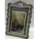 A good silver embossed picture frame with floral d