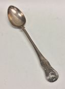 A large silver hourglass pattern basting spoon. Lo