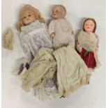 Three various fully dressed dolls. Est. £25 - £35.