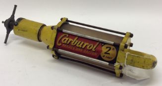 A "Carburol" petrol treatment gun.