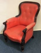 A good leather and mahogany button back chair with