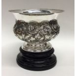 A small embossed silver rose bowl on turned pedest