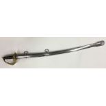 A brass dress sword with scabbard. Est. £50 - £80.