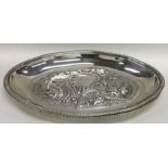 A good pair of heavy silver oval dishes decorated
