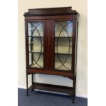 A late Victorian inlaid display cabinet decorated
