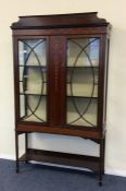 A late Victorian inlaid display cabinet decorated