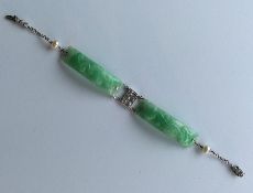 An unusual good quality carved jade, diamond and p