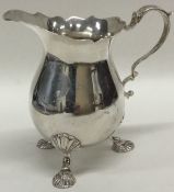 A good silver Edwardian cream jug with card cut ri