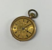 A small lady's gold fob watch with gilt dial and l