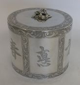 An unusual Georgian silver cylindrical tea caddy a