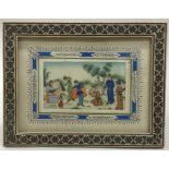 A framed rectangular ivory inlaid picture mounted