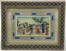 A framed rectangular ivory inlaid picture mounted