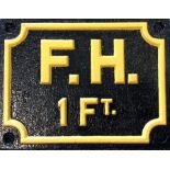 A cast iron "F.H 1 FT" sign. Approx. 20 cms x 15 c