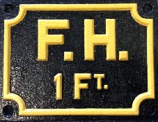 A cast iron "F.H 1 FT" sign. Approx. 20 cms x 15 c