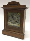 A small mahogany cased mantle clock with silvered