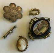 A silver sixpence brooch together with other jewel