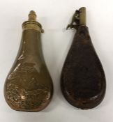 A copper shot flask together with a leather exampl