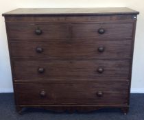 A mahogany chest of five drawers on bracket feet.