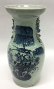 A tall blue ground Chinese vase decorated with bir