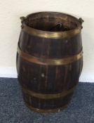 A small oak and brass mounted barrel. Est. £20 - £