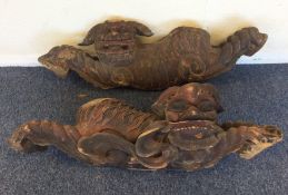 A unusual pair of massive carved Dogs of Foo with