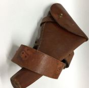 A good leather and brass mounted pistol holster. E