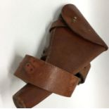 A good leather and brass mounted pistol holster. E