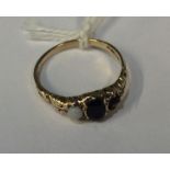 A 9 carat three stone ring in claw mount. Est. £30