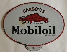 An oval "Gargoyle Mobiloil" double-sided metal and