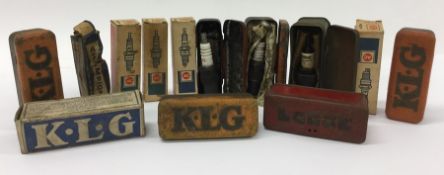 A selection of K.LG and other spark plugs and tins
