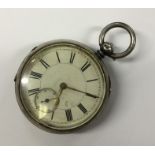 A silver open face large pocket watch decorated wi