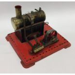 A Mamod steam engine on red base with burner. Est.