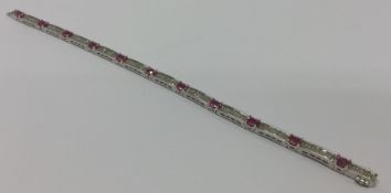 A good diamond and pink sapphire panelled bracelet