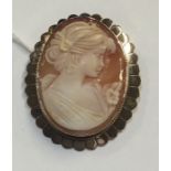 A 9 carat gold framed cameo. Est. £70 - £80.