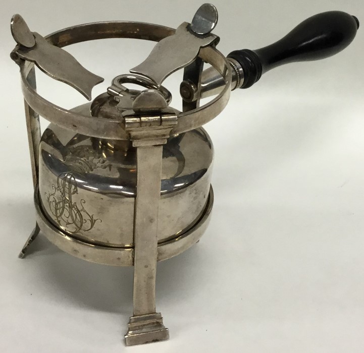 An unusual Continental silver kettle burner on thr