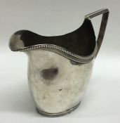 A heavy Georgian style Dutch silver cream jug with