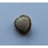 A rare opal and diamond brooch in the form of a wi