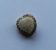 A rare opal and diamond brooch in the form of a wi