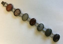 An unusual silver and multi agate bracelet with co