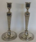 A pair of Georgian fluted candlesticks with beaded