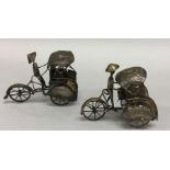 Two Continental silver figures of people on bicycl