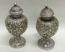 A heavy pair of Indian silver salts decorated with